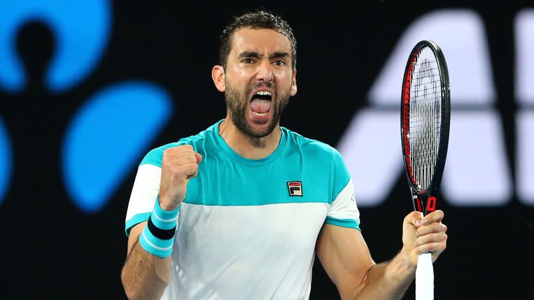 Marin Cilic of Croatia celebrates winning the second set in his semi-final match against Kyle Edmund