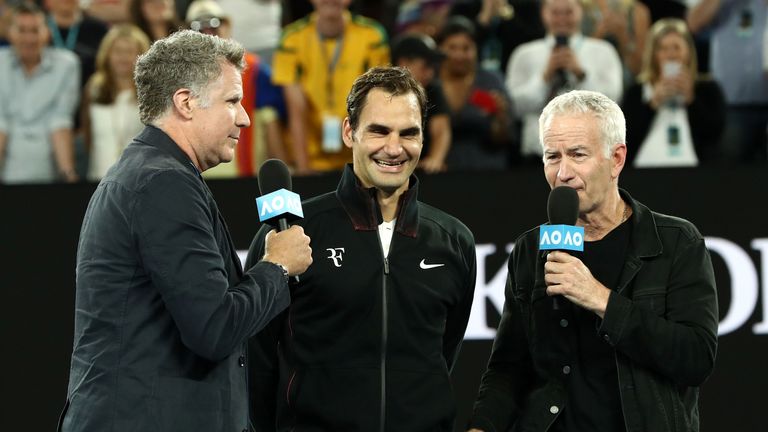Will Ferrell (L) and John McEnroe (R) interview Roger Federer of Switzerland