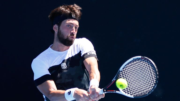 Nikoloz Basilashvili of Georgia plays a backhand in his second round match against Ruben Bemelmans of Belgium