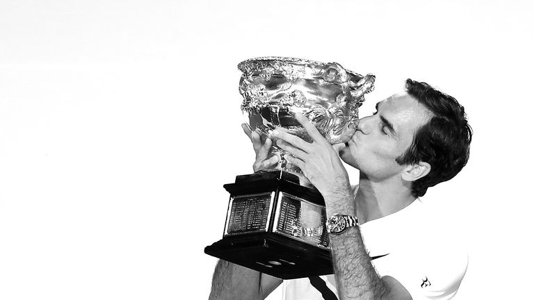 Roger Federer of Switzerland kisses the Norman Brooks Challenge Cup
