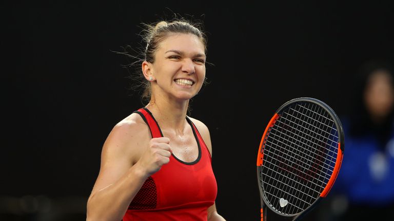 Simona Halep of Romania celebrates winning a point in her second round match against Eugenie Bouchard of Canada