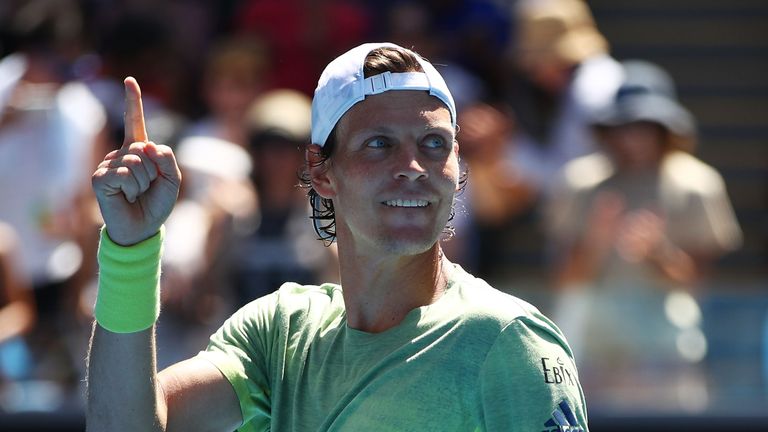 Tomas Berdych of the Czech Republic celebrates winning match point in his fourth round match against Fabio Fognini