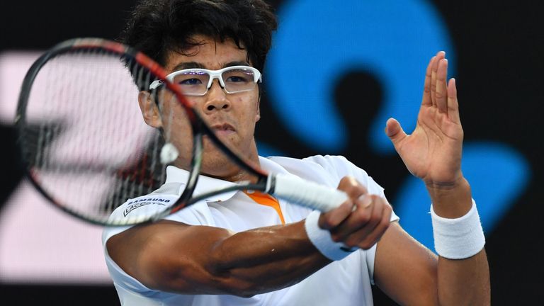 South Korea's Hyeon Chung hits a return against Serbia's Novak Djokovic during their men's singles fourth round match on day eight of the Australian Open