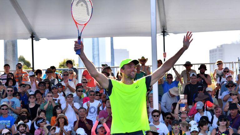 Croatia's Ivo Karlovic reacts after beating Japan's Yuichi Sugita in their men's singles second round match on day three of the Australian Open