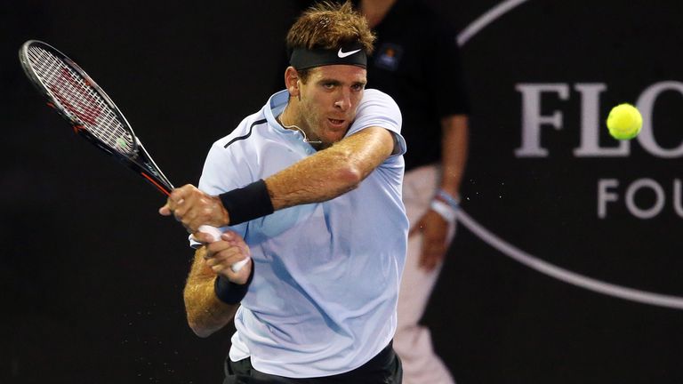 Juan Martin Del Potro of Argentina hits a return against David Ferrer of Spain during their men's singles semi-final match at the ATP Auckland Classic