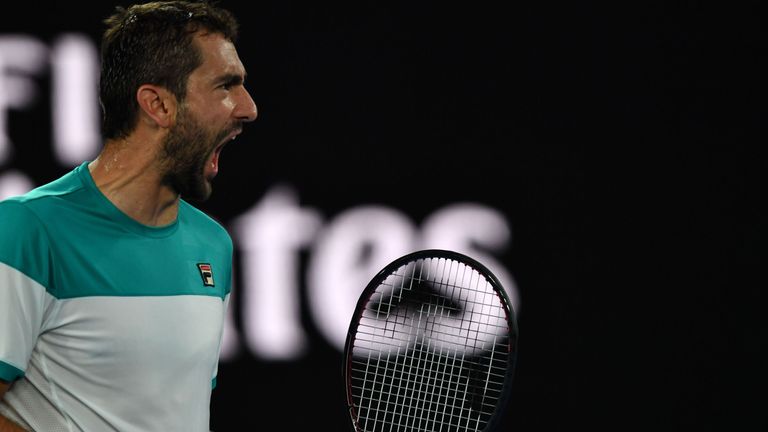 Croatia's Marin Cilic reacts after a point against Spain's Rafael Nadal during their men's singles quarter-finals match on day nine of the Australian Open