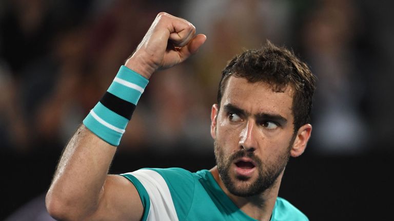 Croatia's Marin Cilic reacts against Spain's Rafael Nadal during their men's singles quarter-finals match on day nine of the Australian Open