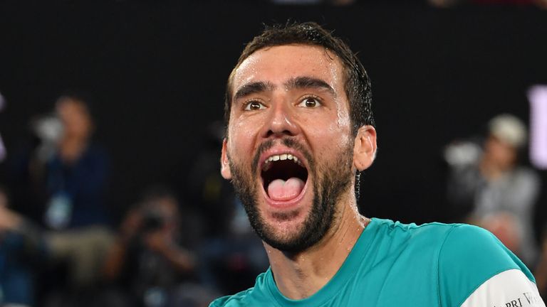 Croatia's Marin Cilic celebrates beating Britain's Kyle Edmund in their men's singles semi-finals match on day 11 of the Australian Open