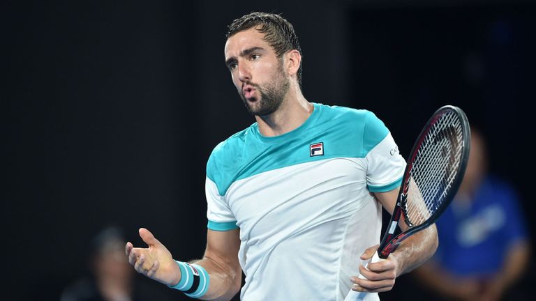 Croatia's Marin Cilic reacts after a point against Switzerland's Roger Federer during their men's singles final match on day 14 of the Australian Open