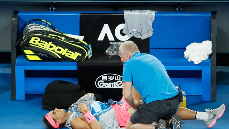 MELBOURNE, AUSTRALIA - JANUARY 23:  Rafael Nadal of Spain receives treatment in his quarter-final match against Marin Cilic of Croatia on day nine of the 2