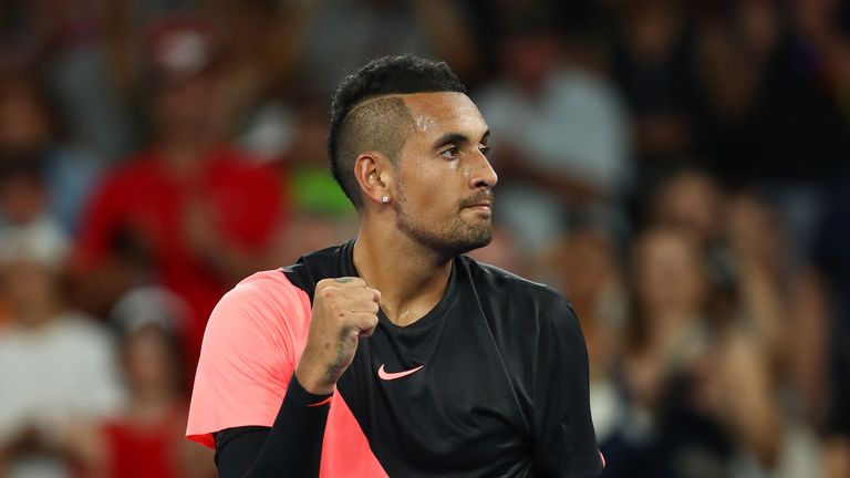 Nick Kyrgios of Australia celebrates winning match point in his second round match against Viktor Troicki of Serbia 