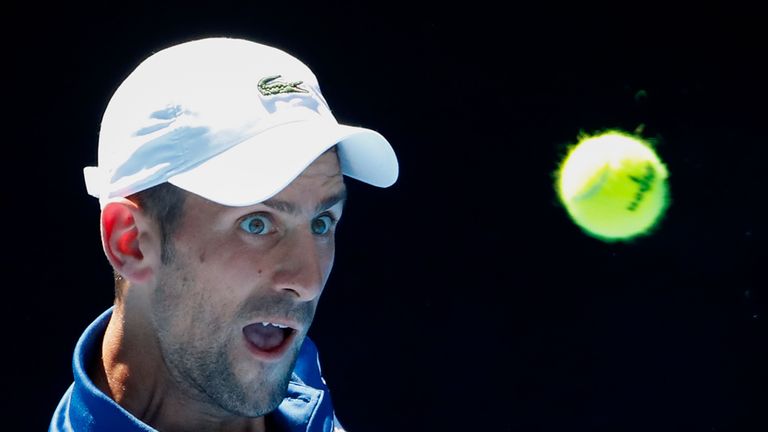 Novak Djokovic of Serbia watches the ball in his second round match against  Gael Monfils of France