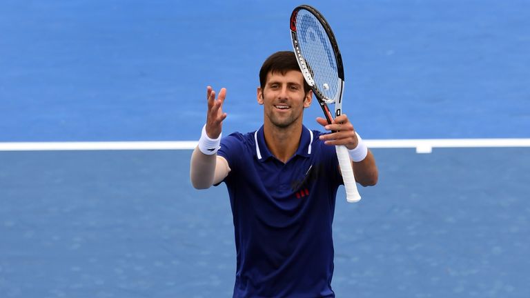Novak Djokovic of Serbia waves to the crowds after winning his match against Dominic Thiem of Austria at Kooyong Classic tennis tournament in Melbourne