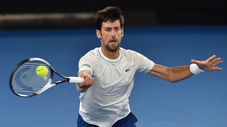 Serbia's Novak Djokovic hits a return during a practice session ahead of the Australian Open tennis tournament in Melbourne