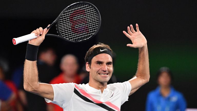 Switzerland's Roger Federer celebrates beating Croatia's Marin Cilic in their men's singles final match on day 14 of the Australian Open