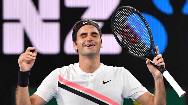 Switzerland's Roger Federer celebrates beating Croatia's Marin Cilic in their men's singles final match on day 14 of the Australian Open