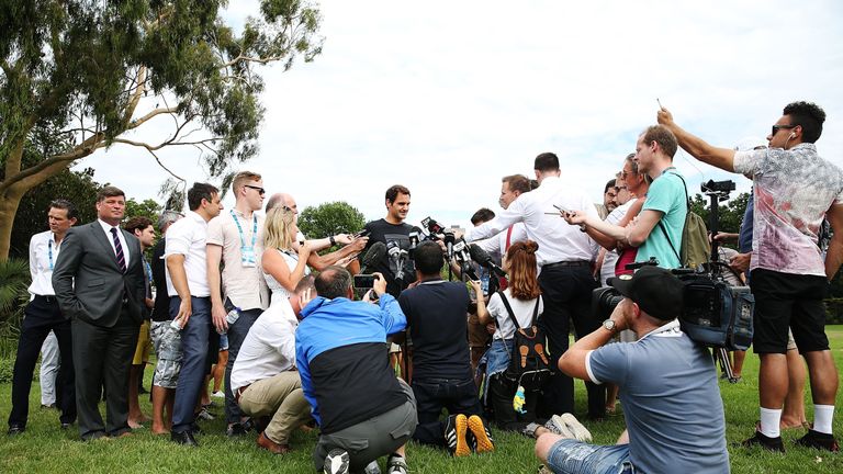 Roger Federer of Switzerland speaks to media with the Norman Brookes Challenge Cup after winning the 2018 Australian Open