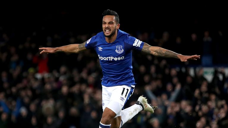 Theo Walcott celebrates after scoring his first Everton goal