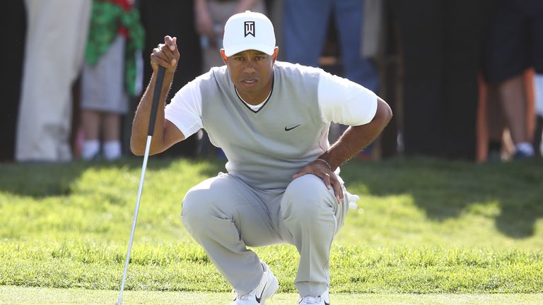 SAN DIEGO, CA - JANUARY 27:  Tiger Woods looks over a putt on the 11th green during the third round of the Farmers Insurance Open at Torrey Pines South on 
