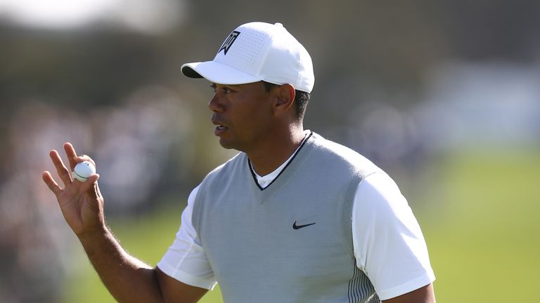 SAN DIEGO, CA - JANUARY 27:  Tiger Woods waves to the crowd after a putt on the 11th green during the third round of the Farmers Insurance Open at Torrey P