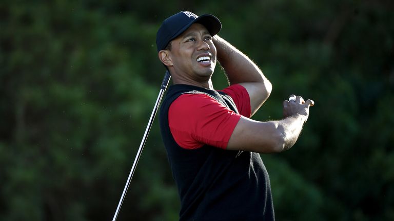SAN DIEGO, CA - JANUARY 28:  Tiger Woods reacts after playing his shot from the 11th tee during the final round of the Farmers Insurance Open at Torrey Pin