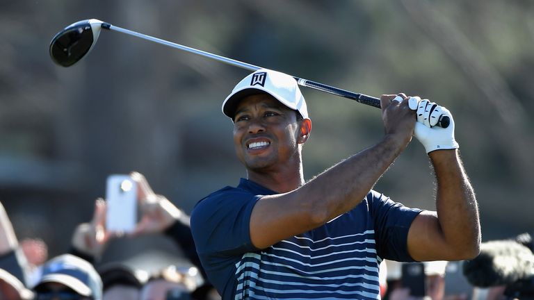 Tiger Woods plays his shot from the 13th tee during the second round of the Farmers Insurance Open at Torrey Pines North 
