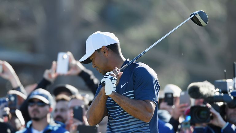 Tiger Woods reacts after playing his shot from the 13th tee during the second round of the Farmers Insurance Open at Torrey Pines
