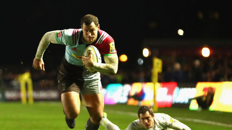 Tim Visser of Harlequins makes a run past Alex Goode of Saracens before scoring the winning try.