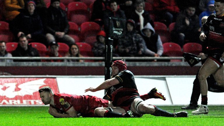 Scarlets' Tom Prydie dives on the ball for his side's second try