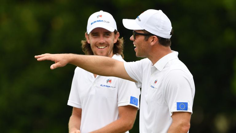 KUALA LUMPUR, MALAYSIA - JANUARY 10:  Paul Casey gestures to Tommy Fleetwood of Team Europe during practice prior to the start of the Eurasia Cup at Glenma