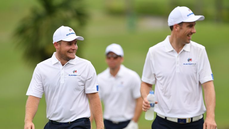 KUALA LUMPUR, MALAYSIA - JANUARY 10:   Tyrrell Hatton and Ross Fisher of Team Europe walk together during practice prior to the start of the Eurasia Cup at