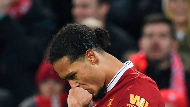 Liverpool's Dutch defender Virgil van Dijk celebrates scoring their second goal during the English FA Cup third round football match between Liverpool and 