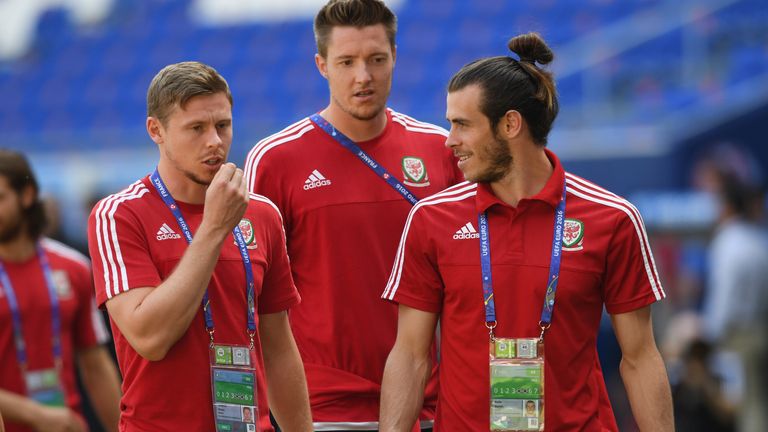 LYON, FRANCE - JULY 05:  Simon Church looks on with Wayne Hennessey and Gareth Bale as the Wales squad visit the Stade de Lyon on July 5, 2016 in Lyon, Fra