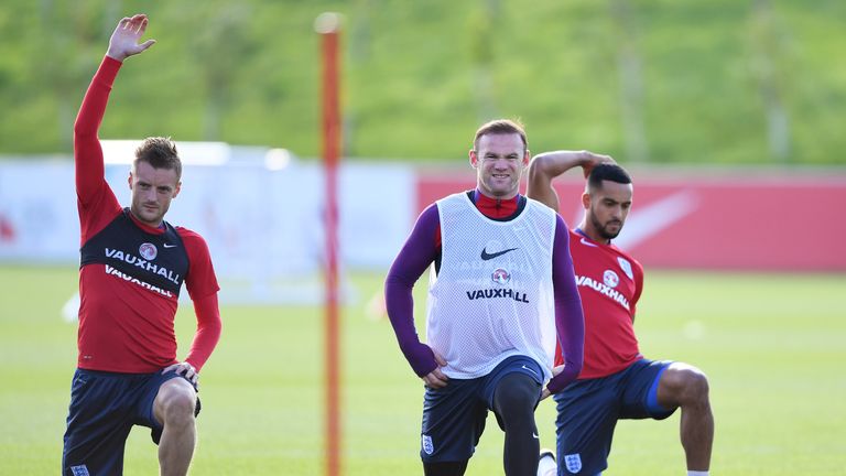 Jamie Vardy, Wayne Rooney and Theo Walcott of England stretch during an England training session at St George's Park in October, 2016