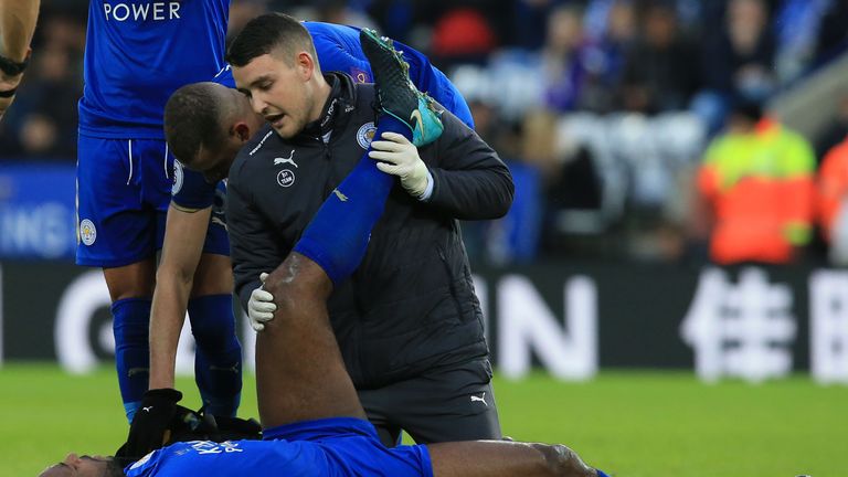 Leicester City's English-born Jamaican defender Wes Morgan receives medical attention during the English Premier League football match between Leicester Ci