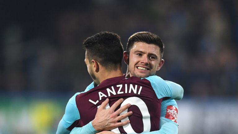 Manuel Lanzini of West Ham United celebrates with Aaron Cresswell after scoring his side's fourth goal against Huddersfield
