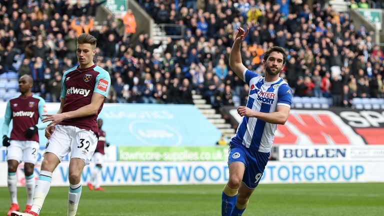 Wigan Athletic striker Will Grigg celebrates after opening the scoring against West Ham
