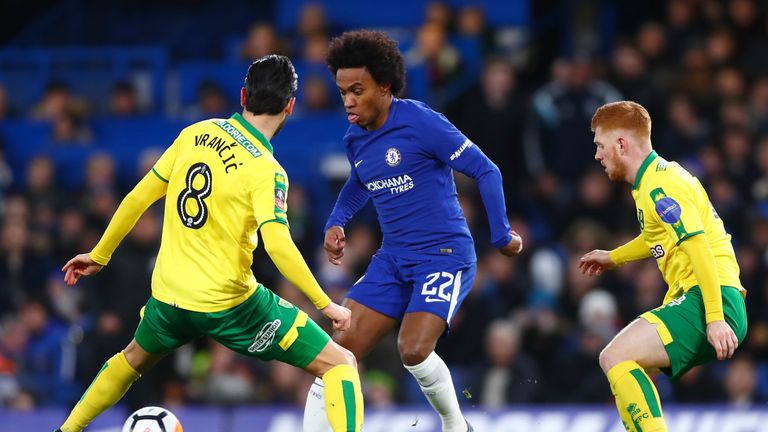 Willian of Chelsea takes on Mario Vrancic of Norwich City  during The Emirates FA Cup Third Round Replay between Chelsea and Norwich