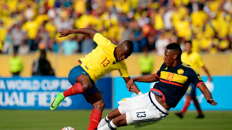 Ecuador's forward Enner Valencia (L) vies for the ball with Colombia's defender Yerry Mina during their 2018 FIFA World Cup qualifier football match in Qui