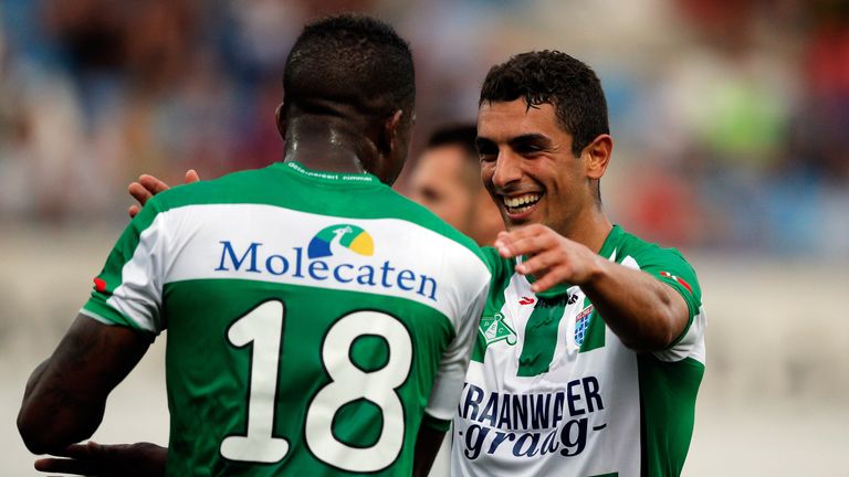 Youness Mokhtar (R) congratulates Guyon Fernandez (#18) of Zwolle on scoring a goal during the Friendly match between PEC Z