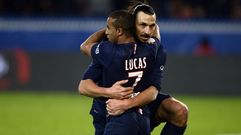 Paris Saint-Germain's Swedish forward Zlatan Ibrahimovic (back) celebrates with Paris Saint-Germain's Brazilian midfielder Lucas Moura after scoring a goal