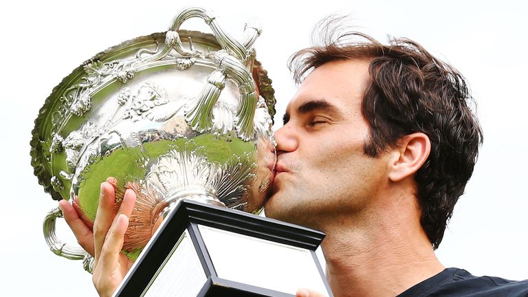 Roger Federer of Switzerland kisses the Norman Brookes Challenge Cup after winning the 2018 Australian Open