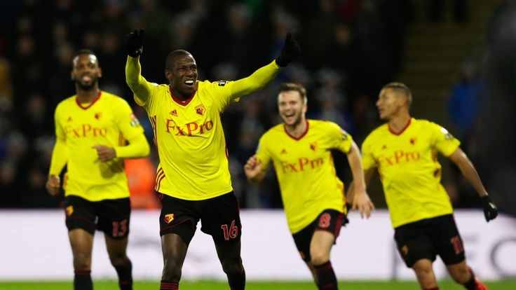 WATFORD, ENGLAND - DECEMBER 26:  Abdoulaye Doucoure of Watford celebrates the own goal scored by Kasper Schmeichel of Leicester City with team mates during