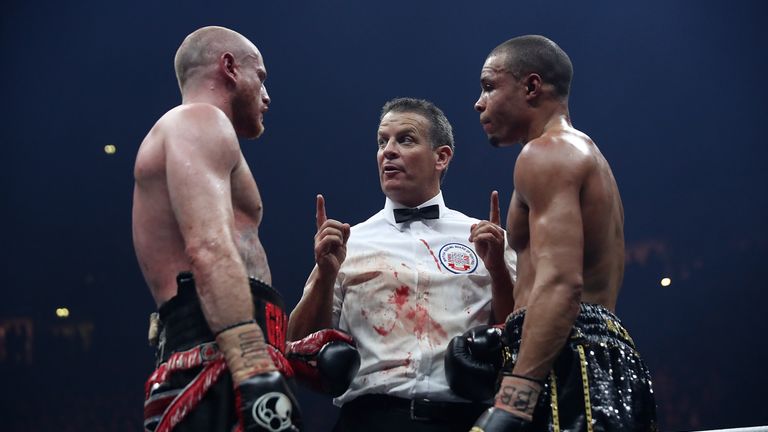 MANCHESTER, ENGLAND - FEBRUARY 17:  The Referee speaks with George Groves of England and Chris Eubank JR of England during their WBSS Super Middleweight bo