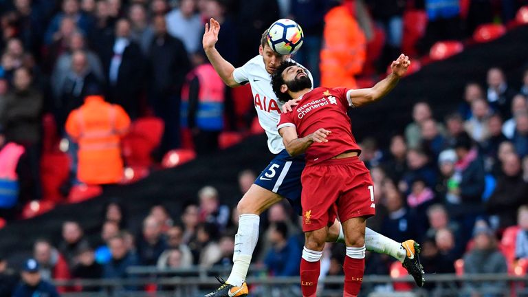 Tottenham Hotspur's Belgian defender Jan Vertonghen (L) vies with Liverpool's Egyptian midfielder Mohamed Salah during a Premier League football match 