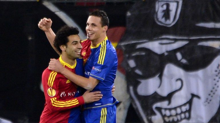 FC Basel midfielder David Degen is congratulated by team-mate Mohamed Salah during their Europa League game against Sporting Lisbon in 2012