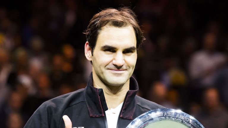 Switzerland's Roger Federer holds his trophy after winning the final match against Bulgary's Grigor Dimitrov at the ABN AMRO World Tennis Tournament in Rot
