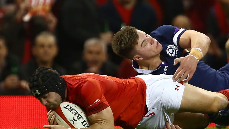 Wales' full-back Leigh Halfpenny goes over the line to score the team's second try