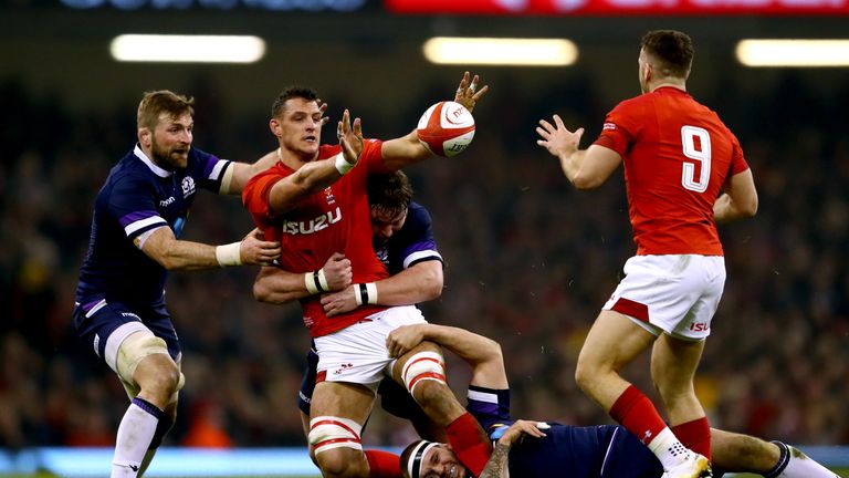 Aaron Shingler looks to offload as he is tackled by Jon Welsh and Gordon Reid