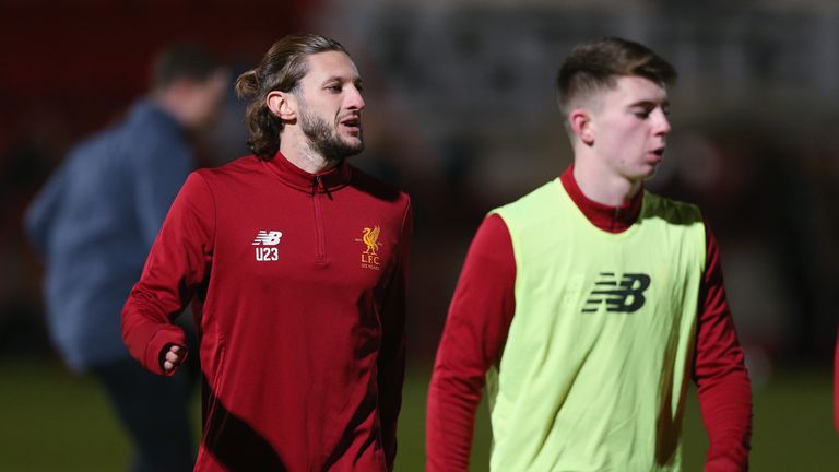 Adam Lallana warms up prior to the Premier League 2 match between Tottenham Hotspur and Liverpool at The Lamex Stadium on February 5, 2018